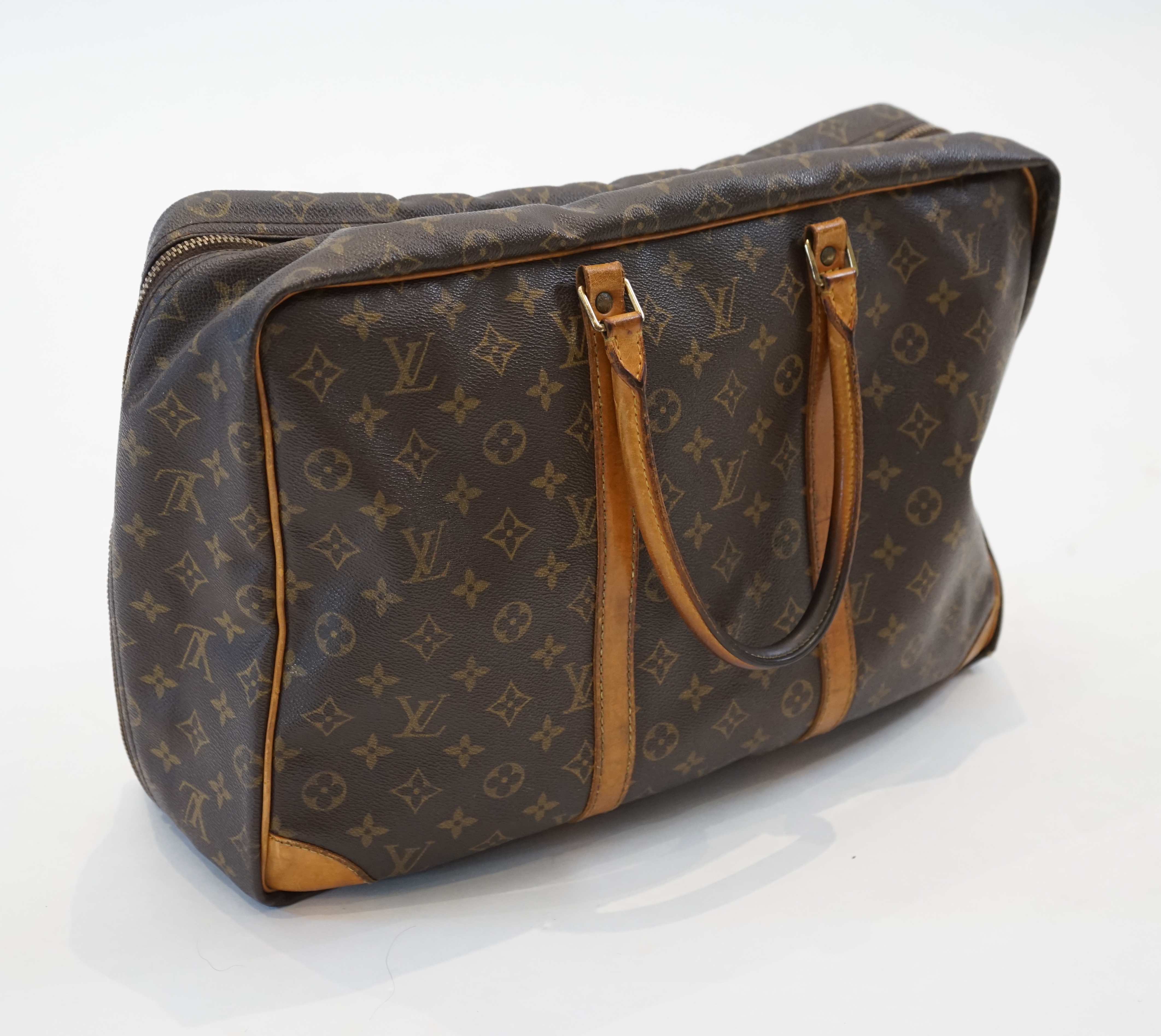 A Louis Vuitton Keepall leather travel bag with luggage tag width 13cm, length 45cm, height 30cm
